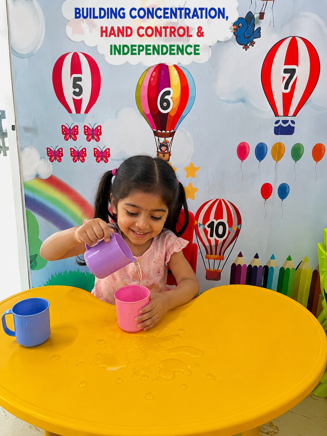Child building hand control and independence